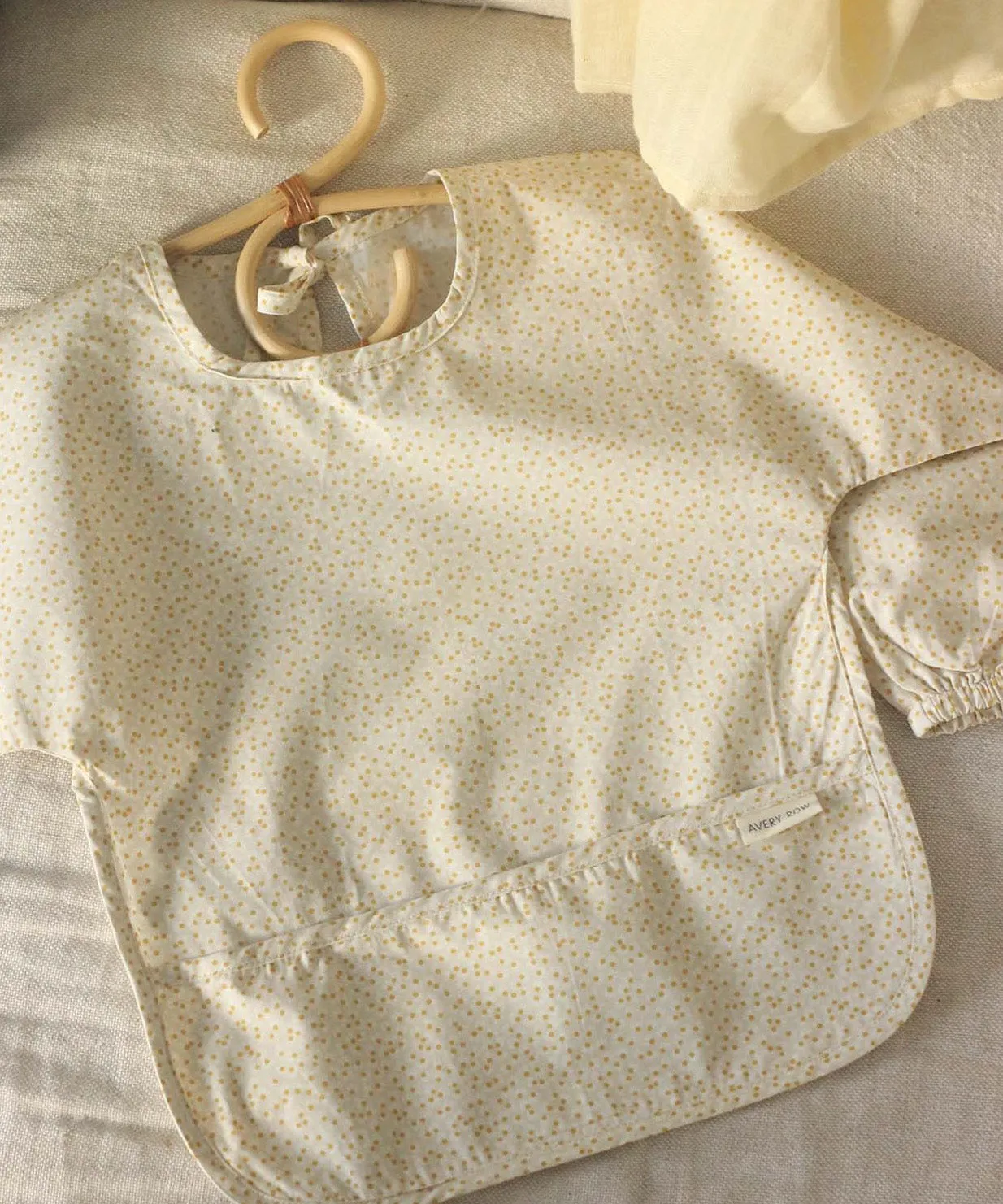 Avery Row Sleeved Bib - Daisy Meadow